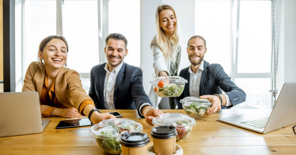 Team collaborating in a bright, wellness-focused workspace